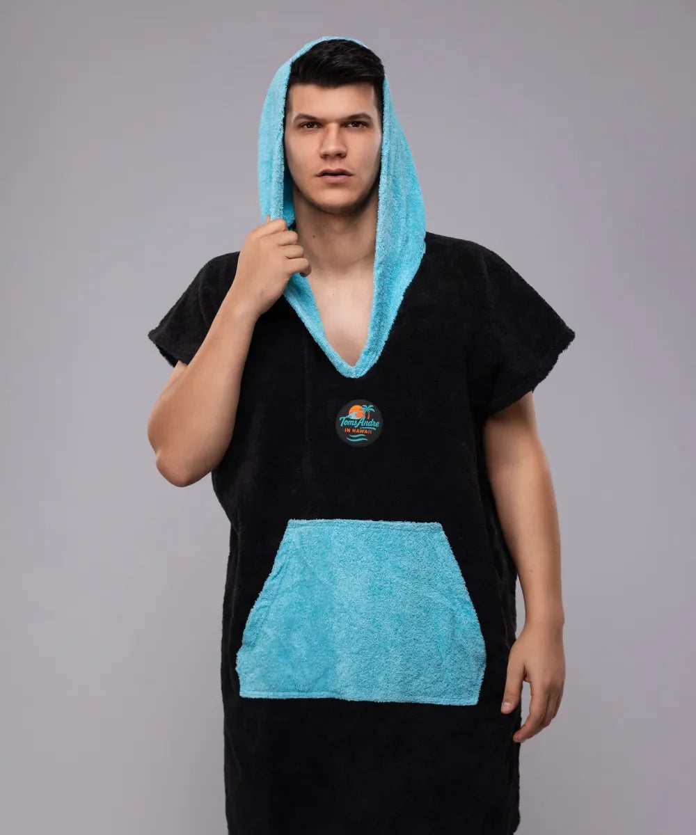 Toms Andre turquoise poncho-towel worn at the beach